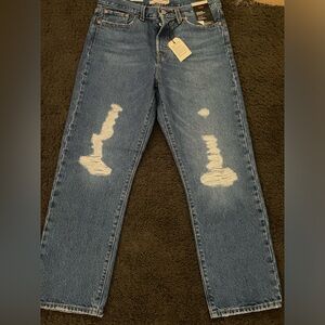 Levi jeans, new w tags